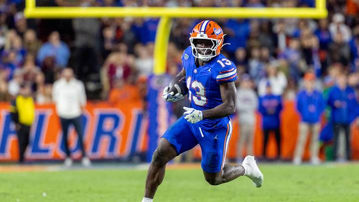 Nov 29, 2025; Gainesville, Florida, USA; Florida Gators running back Jadan Baugh (13) runs with the ball during the third quarter against the Florida State Seminoles at Ben Hill Griffin Stadium. Mandatory Credit: Bob Kupbens-Imagn Images