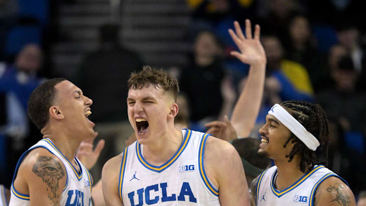 UCLA Bruins guard Kobe Johnson and guard Skyy Clark celebrate with forward Tyler Bilodeau. Mandatory Credit: Jayne Kamin-Oncea-Imagn Images