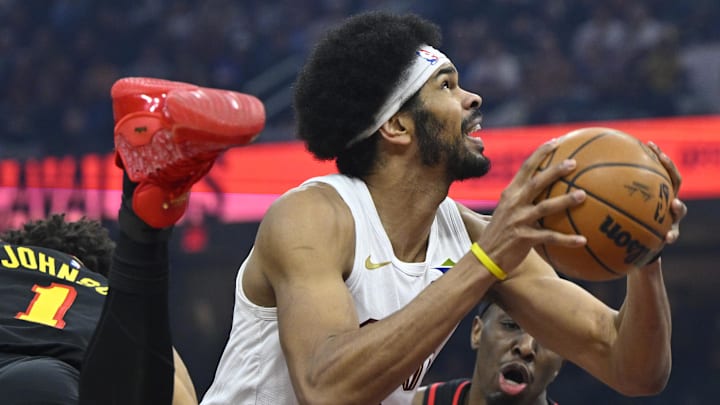 Apr 8, 2026; Cleveland, Ohio, USA; Cleveland Cavaliers center Jarrett Allen (31) looks to the basket between Atlanta Hawks forward Jalen Johnson (1) and forward Onyeka Okongwu (17) in the third quarter at Rocket Arena. Mandatory Credit: David Richard-Imagn Images