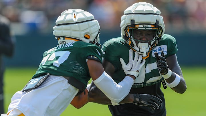 Green Bay Packers cornerbacks Carrington Valentine (37) and Robert Rochell (22) run through a drill during practice on Wednesday, August 14, 2024, at Ray Nitschke Field in Ashwaubenon, Wis.