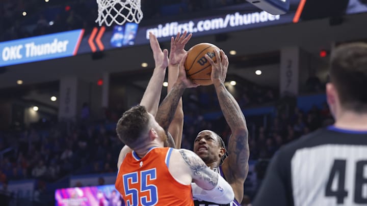 Feb 1, 2025; Oklahoma City, Oklahoma, USA; Sacramento Kings forward DeMar DeRozan (10) is defended by Oklahoma City Thunder center Isaiah Hartenstein (55) during the second quarter at Paycom Center. Mandatory Credit: Alonzo Adams-Imagn Images