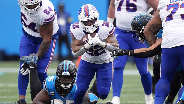 Oct 26, 2025; Charlotte, North Carolina, USA; Buffalo Bills running back Ray Davis (22) runs against Carolina Panthers defensive end Derrick Brown (95) during the second half at Bank of America Stadium. Oct 26, 2025; Charlotte, North Carolina, USA; Buffalo Bills running back Ray Davis (22) runs against Carolina Panthers defensive end Derrick Brown (95) during the second half at Bank of America Stadium.