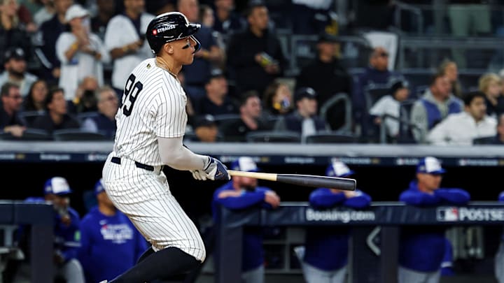 Oct 8, 2025; Bronx, New York, USA; New York Yankees right fielder Aaron Judge (99) hits a single during the first inning against the Toronto Blue Jays during game four of the ALDS round for the 2025 MLB playoffs at Yankee Stadium. Mandatory Credit: Vincent Carchietta-Imagn Images Oct 8, 2025; Bronx, New York, USA; New York Yankees right fielder Aaron Judge (99) hits a single during the first inning against the Toronto Blue Jays during game four of the ALDS round for the 2025 MLB playoffs at Yankee Stadium. Mandatory Credit: Vincent Carchietta-Imagn Images