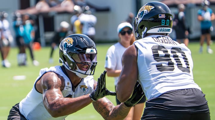 Jacksonville Jaguars defensive end Travon Walker (44) runs drills with Jacksonville Jaguars defensive lineman Emmanuel Ogbah (90) during the fourth organized team activity at the Miller Electric Center in Jacksonville, Fla. Tuesday, May 27, 2025. [Doug Engle/Florida Times-Union]