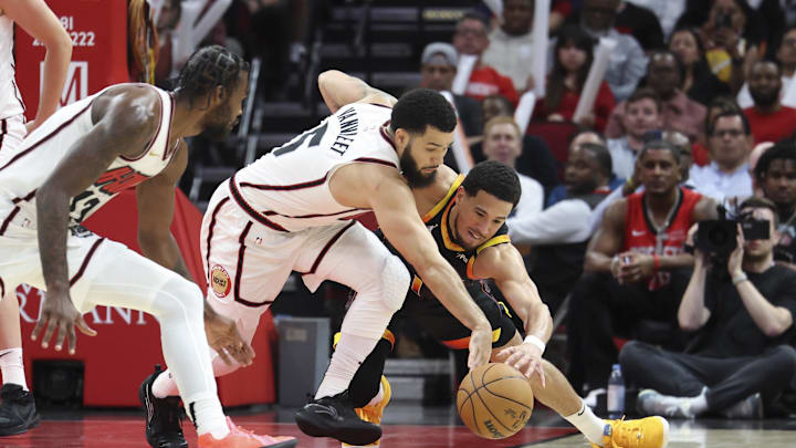 Mar 12, 2025; Houston, Texas, USA; Houston Rockets guard Fred VanVleet (5) and Phoenix Suns guard Devin Booker (1) battle for the ball during the fourth quarter at Toyota Center. Mandatory Credit: Troy Taormina-Imagn Images Mar 12, 2025; Houston, Texas, USA; Houston Rockets guard Fred VanVleet (5) and Phoenix Suns guard Devin Booker (1) battle for the ball during the fourth quarter at Toyota Center. Mandatory Credit: Troy Taormina-Imagn Images