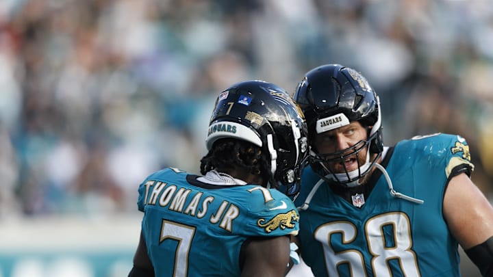 Dec 15, 2024; Jacksonville, Florida, USA; Jacksonville Jaguars wide receiver Brian Thomas Jr. (7) and offensive line Brandon Scherff (68) celebrate a touchdown against the New York Jets during the fourth quarter at EverBank Stadium. Mandatory Credit: Morgan Tencza-Imagn Images Dec 15, 2024; Jacksonville, Florida, USA; Jacksonville Jaguars wide receiver Brian Thomas Jr. (7) and offensive line Brandon Scherff (68) celebrate a touchdown against the New York Jets during the fourth quarter at EverBank Stadium. Mandatory Credit: Morgan Tencza-Imagn Images