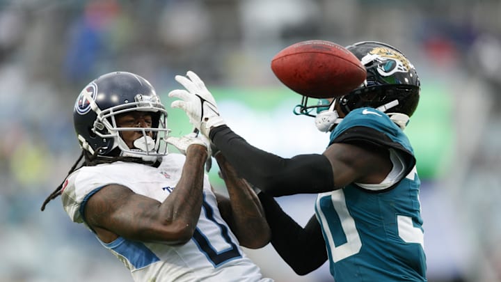 Dec 29, 2024; Jacksonville, Florida, USA; Jacksonville Jaguars cornerback Montaric Brown (30) blocks Tennessee Titans wide receiver Calvin Ridley (0) from catching the ball in the endzone during the third quarter at EverBank Stadium. Mandatory Credit: Morgan Tencza-Imagn Images Dec 29, 2024; Jacksonville, Florida, USA; Jacksonville Jaguars cornerback Montaric Brown (30) blocks Tennessee Titans wide receiver Calvin Ridley (0) from catching the ball in the endzone during the third quarter at EverBank Stadium. Mandatory Credit: Morgan Tencza-Imagn Images