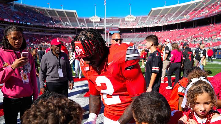 Ohio State Buckeyes running back Legend Bey (2) signs his autograph for fans after defeating Illinois Fighting Illini in the NCAA football game at Ohio Stadium on Sept. 26, 2026 in Columbus, Ohio. Ohio State Buckeyes running back Legend Bey (2) signs his autograph for fans after defeating Illinois Fighting Illini in the NCAA football game at Ohio Stadium on Sept. 26, 2026 in Columbus, Ohio.