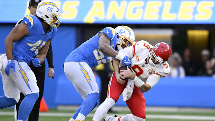Jan 7, 2024; Inglewood, California, USA; Kansas City Chiefs quarterback Blaine Gabbert (9) is sacked by Los Angeles Chargers linebacker Khalil Mack (52) during the first half at SoFi Stadium. Mandatory Credit: Orlando Ramirez-USA TODAY Sports