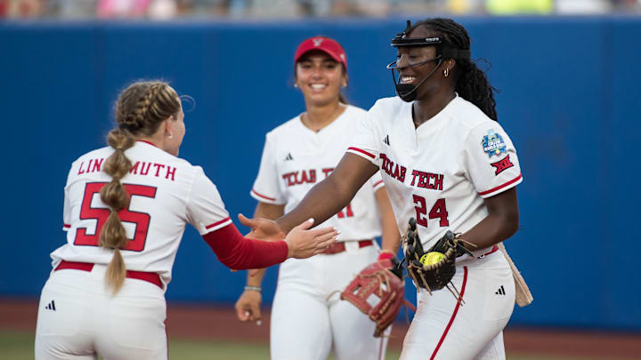 Jun 5, 2025; Oklahoma City, OK, USA; Texas Tech Red Raiders pitcher NiJaree Canady (24) slaps utility Bailey Lindemuth (55) hand and infielder Lauren Allred (11) looks on after Canady made a diving catch for an out in the second inning against the Texas Longhorns during game two of the NCAA Softball Women's College World Series finals at Devon Park. Mandatory Credit: Brett Rojo-Imagn Images Jun 5, 2025; Oklahoma City, OK, USA; Texas Tech Red Raiders pitcher NiJaree Canady (24) slaps utility Bailey Lindemuth (55) hand and infielder Lauren Allred (11) looks on after Canady made a diving catch for an out in the second inning against the Texas Longhorns during game two of the NCAA Softball Women's College World Series finals at Devon Park. Mandatory Credit: Brett Rojo-Imagn Images
