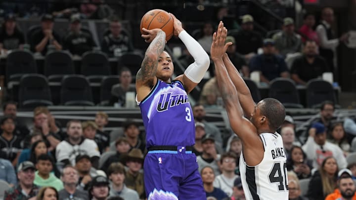 Jan 19, 2026; San Antonio, Texas, USA;  Utah Jazz guard Keyonte George (3) shoots over San Antonio Spurs forward Harrison Barnes (40) in the first half at Frost Bank Center. Mandatory Credit: Daniel Dunn-Imagn Images