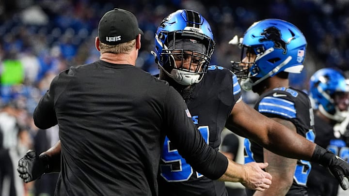 Detroit Lions head coach Dan Campbell hugs defensive end Levi Onwuzurike (91) at warm up before the game between Detroit Lions and Buffalo Bills at Ford Field in Detroit on Sunday, Dec. 15, 2024.