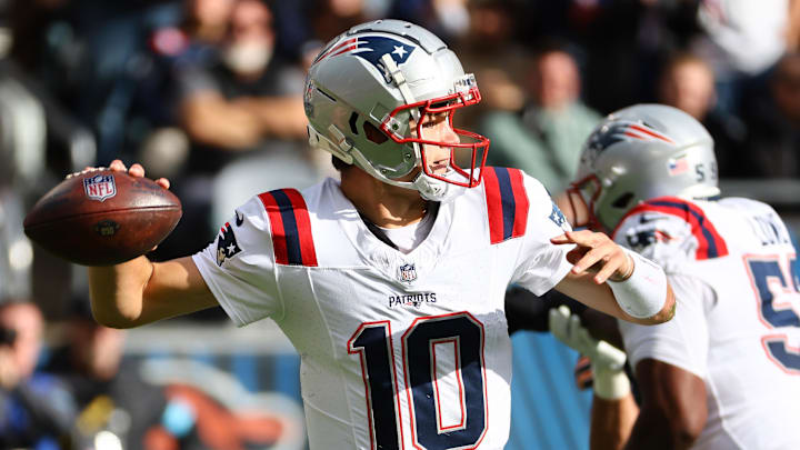 Nov 10, 2024; Chicago, Illinois, USA; New England Patriots quarterback Drake Maye (10) drops back to pass against the Chicago Bears during the first quarter at Soldier Field.
