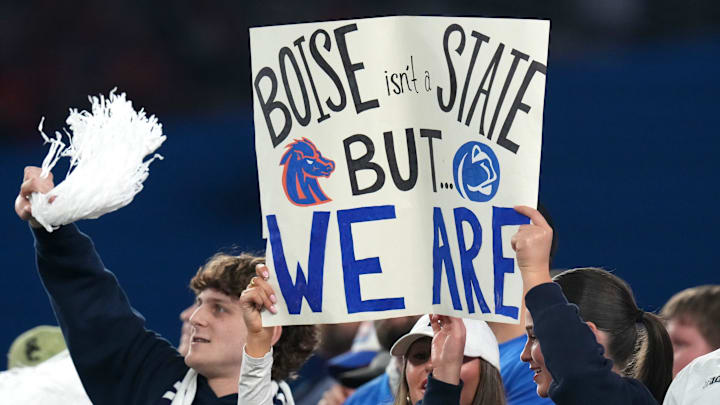 Dec 31, 2024; Glendale, AZ, US; Fans watch from the stands as the Penn State Nittany Lions play the Boise State Broncos during their Vrbo Fiesta Bowl matchup at State Farm Stadium. Dec 31, 2024; Glendale, AZ, US; Fans watch from the stands as the Penn State Nittany Lions play the Boise State Broncos during their Vrbo Fiesta Bowl matchup at State Farm Stadium.