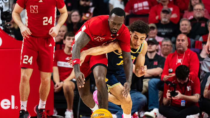 Feb 24, 2025; Lincoln, Nebraska, USA; Nebraska Cornhuskers forward Juwan Gary (4) dives for the ball against Michigan Wolverines guard Justin Pippen (10) during the second half at Pinnacle Bank Arena.