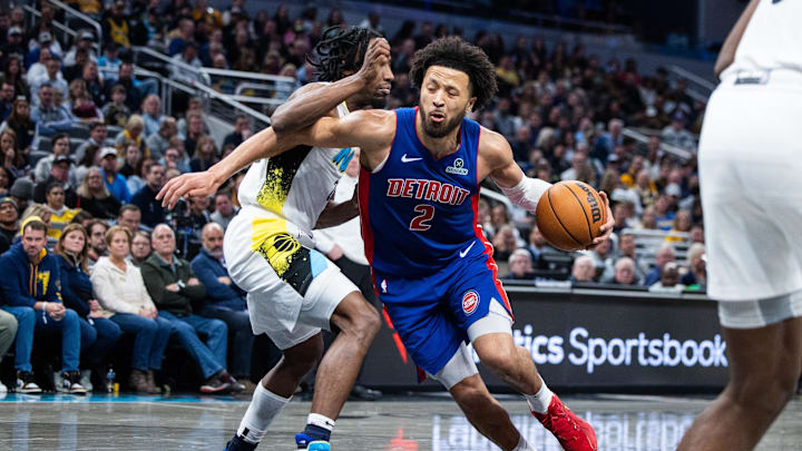 Jan 29, 2025; Indianapolis, Indiana, USA; Detroit Pistons guard Cade Cunningham (2) dribbles the ball while Indiana Pacers forward Aaron Nesmith (23) defends in the second half at Gainbridge Fieldhouse. Mandatory Credit: Trevor Ruszkowski-Imagn Images