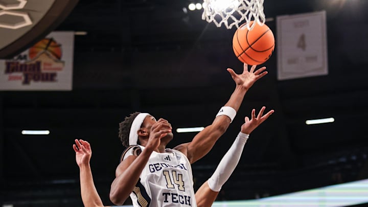 Mar 4, 2026; Atlanta, Georgia, USA; Georgia Tech Yellow Jackets forward Kowacie Reeves Jr. (14) rebounds the ball against the California Golden Bears during the first half at McCamish Pavilion. Mandatory Credit: Jordan Godfree-Imagn Images