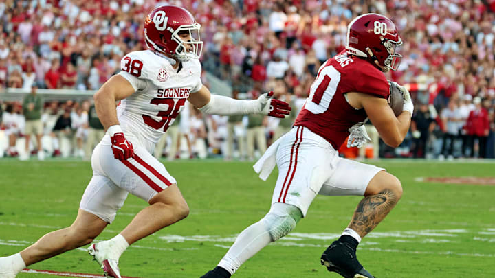 Nov 15, 2025; Tuscaloosa, Alabama, USA;  Alabama Crimson Tide tight end Josh Cuevas (80) runs with the ball against Oklahoma Sooners linebacker Owen Heinecke (38) during the first half at Saban Field at Bryant-Denny Stadium. 