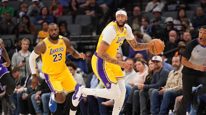 Los Angeles Lakers forward Anthony Davis (3) dribbles the ball next to forward LeBron James (23) against the Sacramento Kings in the first quarter at the Golden 1 Center. 