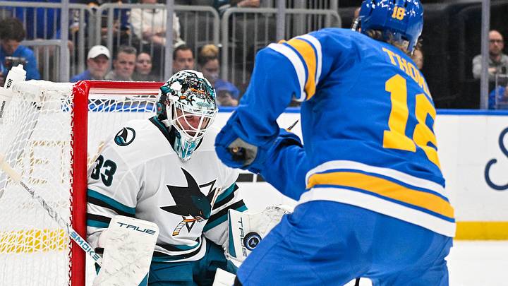 Oct 8, 2026; St. Louis, Missouri, USA; San Jose Sharks goaltender Alex Nedeljkovic (33) makes a save against St. Louis Blues center Robert Thomas (18) during the second period at Enterprise Center. Mandatory Credit: Jeff Curry-Imagn Images