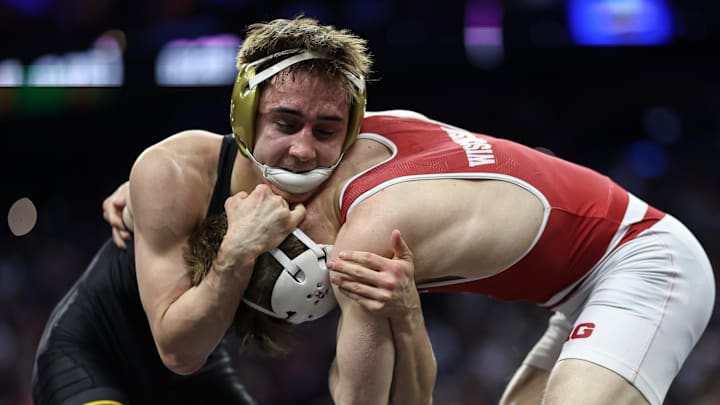 Mar 21, 2025; Philadelphia, PA, USA; Drake Ayala of Iowa wrestles Zan Fugitt of Wisconsin during the semifinals of the NCAA Wrestling Championships at Wells Fargo Center. Mandatory Credit: Bill Streicher-Imagn Images