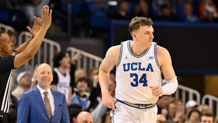 Feb 21, 2026; Los Angeles, California, USA; UCLA forward Tyler Bilodeau (34) runs back on defense after scoring a three-point basket during the second half against the Illinois Fighting Illini at Pauley Pavilion presented by Wescom Financial. Mandatory Credit: Robert Hanashiro-Imagn Images