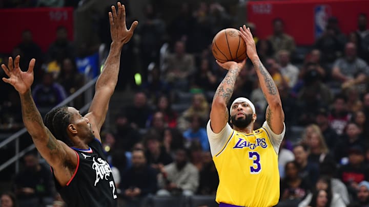 Los Angeles Lakers forward Anthony Davis (3) shoots against Los Angeles Clippers forward Kawhi Leonard (2) during the first half at Crypto.com Arena. Mandatory Credit: Gary A. Vasquez-Imagn Images