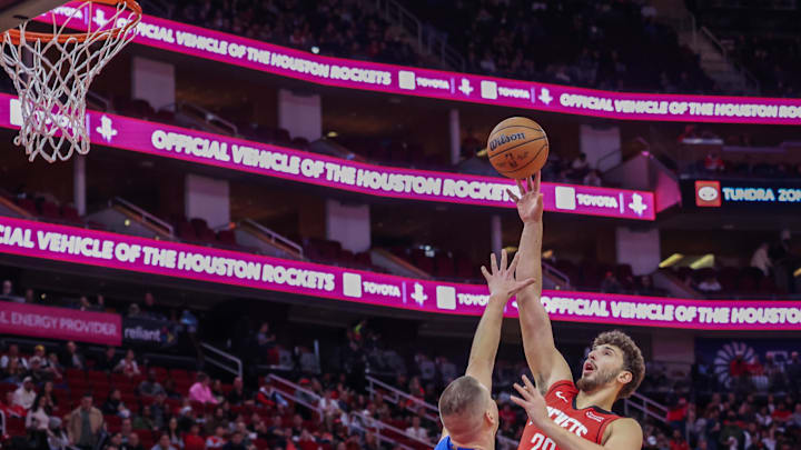 Nov 12, 2023; Houston, Texas, USA; Houston Rockets center Alperen Sengun (28) shoots against Denver Nuggets center Nikola Jokic (15) in the first quarter  at Toyota Center. Mandatory Credit: Thomas Shea-Imagn Images