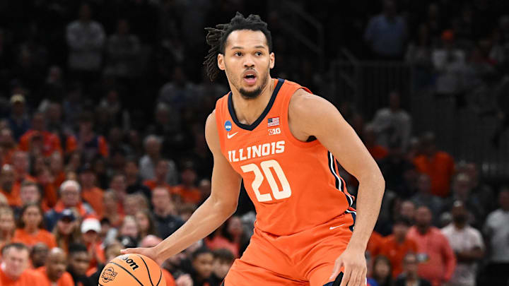 Mar 30, 2024; Boston, MA, USA; Illinois Fighting Illini forward Ty Rodgers (20) dribbles the ball against the Connecticut Huskies in the finals of the East Regional of the 2024 NCAA Tournament at TD Garden. Mandatory Credit: Brian Fluharty-Imagn Images 