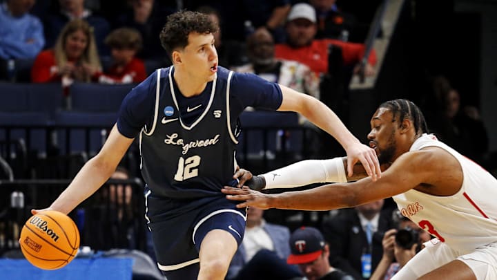 Mar 22, 2024; Memphis, TN, USA;  Longwood Lancers center Szymon Zapala (12) handles the ball against