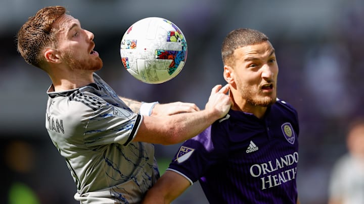 Feb 27, 2022; Orlando, Florida, USA;  CF Montr  al defender Joel Waterman (16) and Orlando City