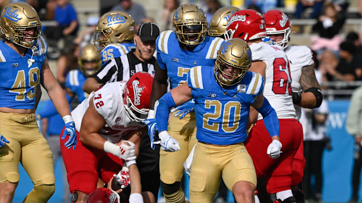 Nov 30, 2024; Pasadena, California, USA; UCLA Bruins linebacker Kain Medrano (20) celebrates sacking Fresno State Bulldogs quarterback Mikey Keene (1) during the section quarter at Rose Bowl. Mandatory Credit: Robert Hanashiro-Imagn Images
