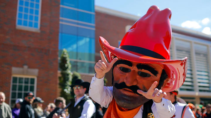 Oct 14, 2023; Stillwater, Oklahoma, USA; Oklahoma State Cowboys mascot Pistol Pete walks to Boone Pickens Stadium before a game between the Oklahoma State Cowboys and Kansas Jayhawks. Mandatory Credit: Nathan J. Fish-Imagn Images