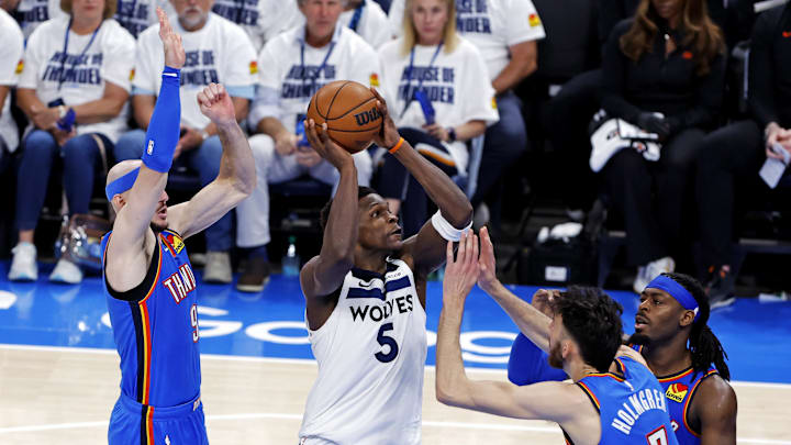 May 28, 2025; Oklahoma City, Oklahoma, USA; Minnesota Timberwolves guard Anthony Edwards (5) drives to the basket against Oklahoma City Thunder guard Alex Caruso (9) during the third quarter in game five of the western conference finals for the 2025 NBA Playoffs at Paycom Center. Mandatory Credit: Alonzo Adams-Imagn Images