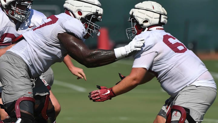 The Alabama Crimson Tide football team works out Sunday morning in practice as they prepare for the 2024 season. Alabama offensive lineman Jaeden Roberts (77) works against a teammate.