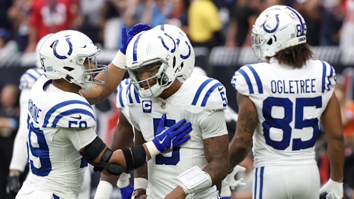 Indianapolis Colts quarterback Anthony Richardson (5) is consulted by linebacker Cameron McGrone (59) after being sacked by the Houston Texans in the second half at NRG Stadium.