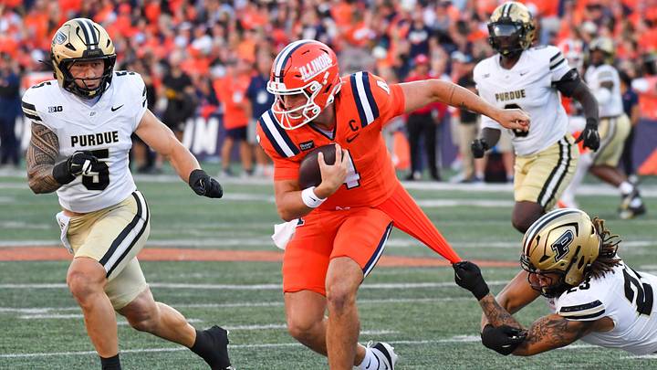 Oct 3, 2026; Champaign, Illinois, USA; Purdue Boilermakers defensive end Trey Smith (23) hangs onto the jersey of Illinois Fighting Illini quarterback Katin Houser (4) as he runs with the ball during the second half at Gies Memorial Stadium. Mandatory Credit: Ron Johnson-Imagn Images Oct 3, 2026; Champaign, Illinois, USA; Purdue Boilermakers defensive end Trey Smith (23) hangs onto the jersey of Illinois Fighting Illini quarterback Katin Houser (4) as he runs with the ball during the second half at Gies Memorial Stadium. Mandatory Credit: Ron Johnson-Imagn Images