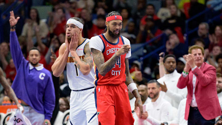 Nov 15, 2024; New Orleans, Louisiana, USA; New Orleans Pelicans forward Brandon Ingram (14) celebrates a three point basket by guard Jaylen Nowell (not pictured) next to Denver Nuggets forward Michael Porter Jr. (1) during the first half at Smoothie King Center. Mandatory Credit: Matthew Hinton-Imagn Images Nov 15, 2024; New Orleans, Louisiana, USA; New Orleans Pelicans forward Brandon Ingram (14) celebrates a three point basket by guard Jaylen Nowell (not pictured) next to Denver Nuggets forward Michael Porter Jr. (1) during the first half at Smoothie King Center. Mandatory Credit: Matthew Hinton-Imagn Images