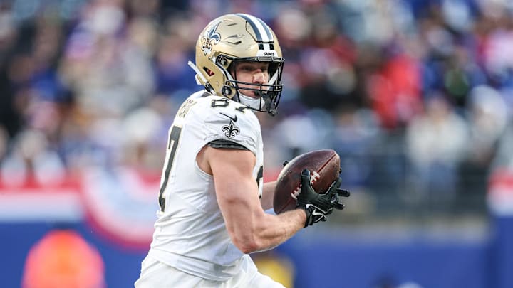 Dec 8, 2024; East Rutherford, New Jersey, USA; New Orleans Saints tight end Foster Moreau (87) makes a catch during the second half against the New York Giants at MetLife Stadium. Mandatory Credit: Vincent Carchietta-Imagn Images
