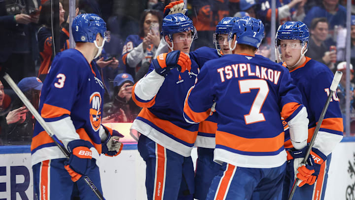 Mar 4, 2025; Elmont, New York, USA;  New York Islanders center Brock Nelson (29) celebrates with his teammates after scoring a goal in the second period against the Winnipeg Jets at UBS Arena. Mandatory Credit: Wendell Cruz-Imagn Images