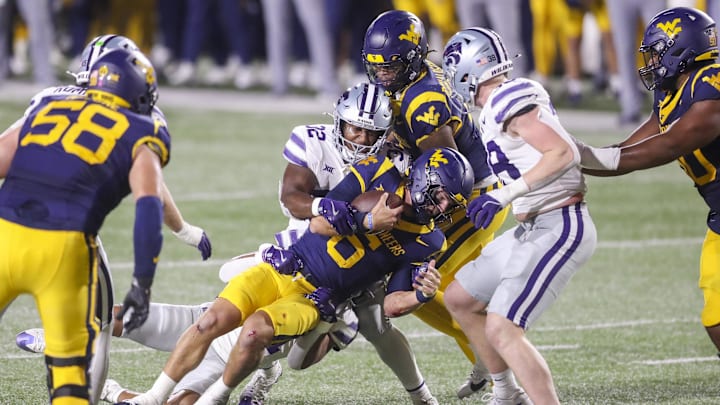 Oct 19, 2024; Morgantown, West Virginia, USA; Kansas State Wildcats linebacker Desmond Purnell (32) sacks West Virginia Mountaineers quarterback Garrett Greene (6) during the second quarter at Mountaineer Field at Milan Puskar Stadium. Mandatory Credit: Ben Queen-Imagn Images