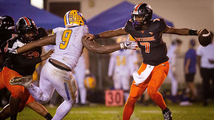 Newberry Panthers Mykah Newton (9) tries to sack \h7u\ in the first half. The Hawthorne Hornets hosted the Newberry Panthers at Hawthorne High School in Hawthorne, FL on Friday, November 17, 2023 in the Class 1R-Region 4 Semifinals. Hawthorne lead 21-0 at the half. [Doug Engle/Ocala Star Banner]