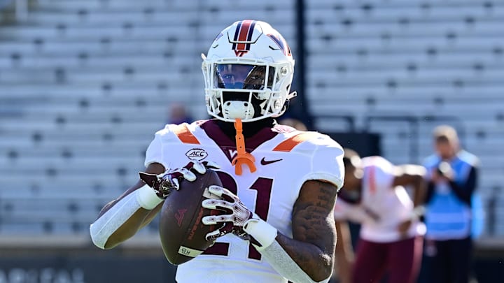 Nov 11, 2023; Chestnut Hill, Massachusetts, USA; Virginia Tech Hokies running back Jeremiah Coney (21) warms up before a game against the Boston College Eagles at Alumni Stadium. Mandatory Credit: Eric Canha-Imagn Images