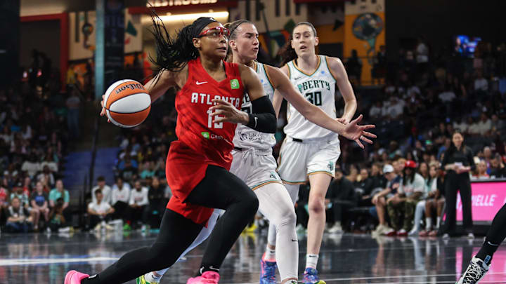 Jun 29, 2025; College Park, Georgia, USA; Atlanta Dream guard Allisha Gray (15) drives the ball towards the basket against New York Liberty guard Sabrina Ionescu (20) during the first quarter at Gateway Center Arena at College Park. Mandatory Credit: Jordan Godfree-Imagn Images Jun 29, 2025; College Park, Georgia, USA; Atlanta Dream guard Allisha Gray (15) drives the ball towards the basket against New York Liberty guard Sabrina Ionescu (20) during the first quarter at Gateway Center Arena at College Park. Mandatory Credit: Jordan Godfree-Imagn Images