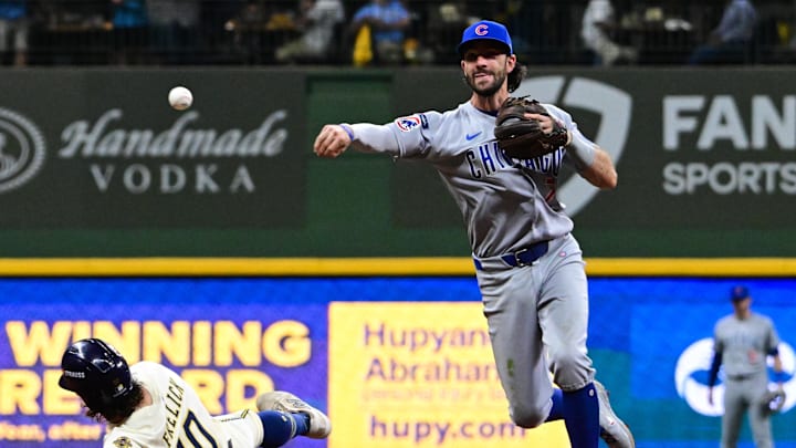 Oct 6, 2025; Milwaukee, Wisconsin, USA; Chicago Cubs shortstop Dansby Swanson (7) turns a double play on Milwaukee Brewers right fielder Sal Frelick (10) and Milwaukee Brewers third baseman Caleb Durbin (21) (not pictured) during the eighth inning during game two of the NLDS round for the 2025 MLB playoffs at American Family Field. Mandatory Credit: Benny Sieu-Imagn Images Oct 6, 2025; Milwaukee, Wisconsin, USA; Chicago Cubs shortstop Dansby Swanson (7) turns a double play on Milwaukee Brewers right fielder Sal Frelick (10) and Milwaukee Brewers third baseman Caleb Durbin (21) (not pictured) during the eighth inning during game two of the NLDS round for the 2025 MLB playoffs at American Family Field. Mandatory Credit: Benny Sieu-Imagn Images