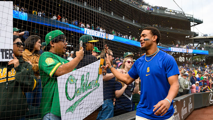 Seattle Mariners center fielder Julio Rodriguez (44) interacts with fans after the game against the Oakland Athletics at T-Mobile Park on Sept 29. Seattle Mariners center fielder Julio Rodriguez (44) interacts with fans after the game against the Oakland Athletics at T-Mobile Park on Sept 29.