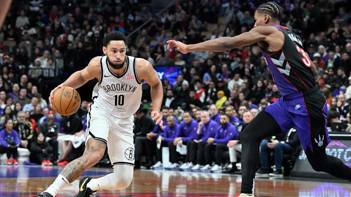 Dec 19, 2024; Toronto, Ontario, CAN; Brooklyn Nets guard Ben Simmons (10) dribbles the ball as Toronto Raptors guard Ochai Agbaji (30) defends in the first half at Scotiabank Arena. Mandatory Credit: Dan Hamilton-Imagn Images Dec 19, 2024; Toronto, Ontario, CAN; Brooklyn Nets guard Ben Simmons (10) dribbles the ball as Toronto Raptors guard Ochai Agbaji (30) defends in the first half at Scotiabank Arena. Mandatory Credit: Dan Hamilton-Imagn Images