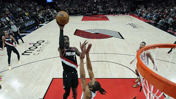 Jan 14, 2025; Portland, Oregon, USA; Portland Trail Blazers center Deandre Ayton (2) shoots the ball over Brooklyn Nets forward Tosan Evbuomwan (12) during the first half at Moda Center. Mandatory Credit: Soobum Im-Imagn Images Jan 14, 2025; Portland, Oregon, USA; Portland Trail Blazers center Deandre Ayton (2) shoots the ball over Brooklyn Nets forward Tosan Evbuomwan (12) during the first half at Moda Center. Mandatory Credit: Soobum Im-Imagn Images