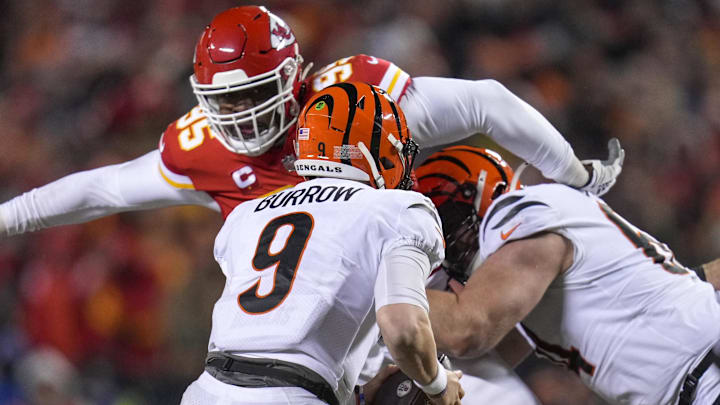 Jan 29, 2023; Kansas City, Missouri, USA;  Cincinnati Bengals quarterback Joe Burrow (9) scrambles as Kansas City Chiefs defensive tackle Chris Jones (95) breaks through the line in the third quarter of the AFC championship NFL game between the Cincinnati Bengals and the Kansas City Chiefs, Sunday, Jan. 29, 2023, at Arrowhead Stadium in Kansas City, Mo. The Kansas City Chiefs advanced to the Super Bowl with a 23-20 win over the Bengals.Mandatory Credit: Sam Greene-Imagn Images