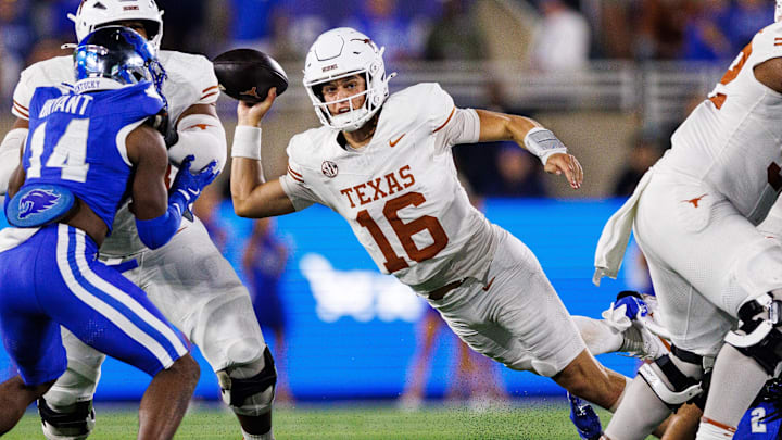 Texas Longhorns quarterback Arch Manning (16) throws a pass during the third quarter against the Kentucky Wildcats at Kroger Field. Texas Longhorns quarterback Arch Manning (16) throws a pass during the third quarter against the Kentucky Wildcats at Kroger Field.